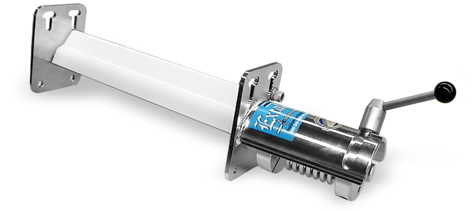 Food-grade conveyor belt scraper installed near a discharge point above a stainless steel catch pan