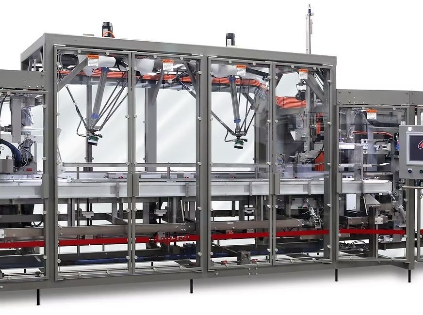 Wide view of an automated food packaging line with conveyors and end-of-line packaging equipment.